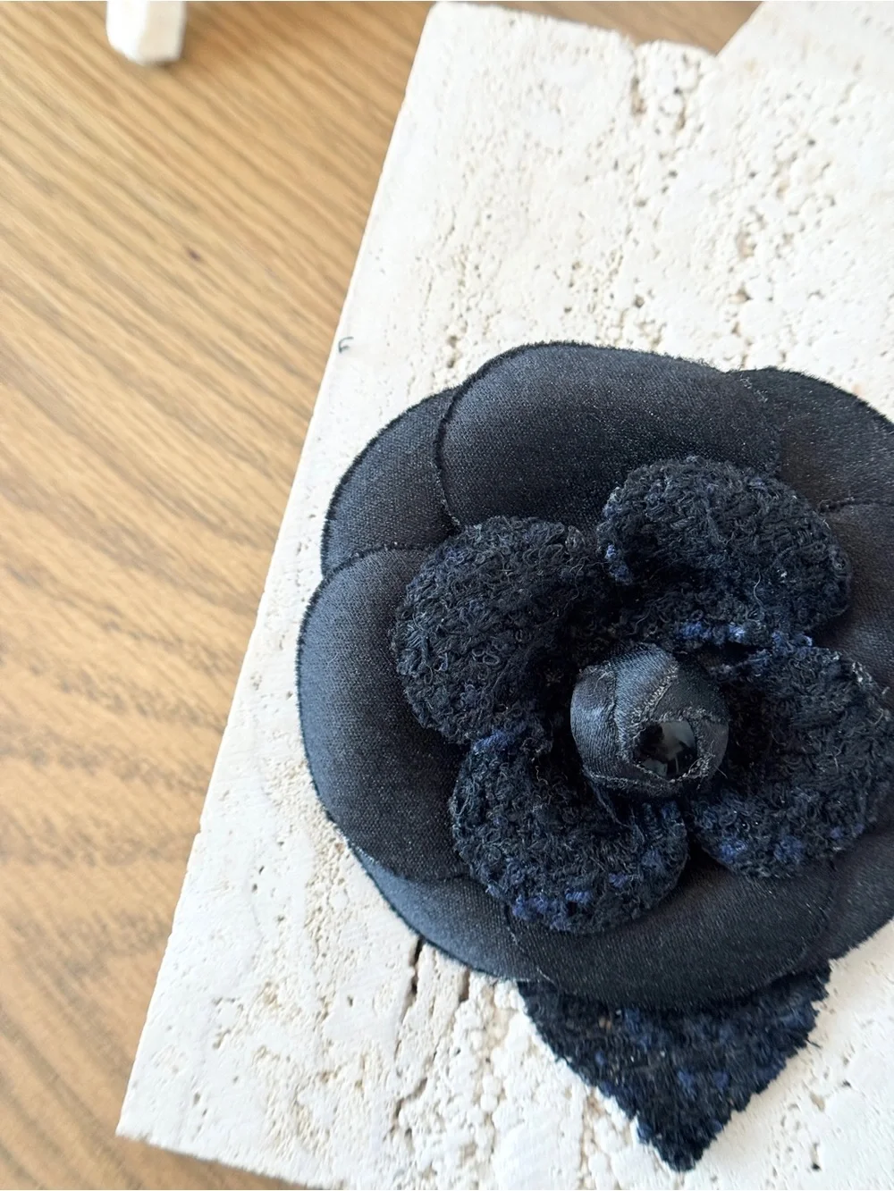 CHANEL Camélia Brooch crafted from black tweed/canvas